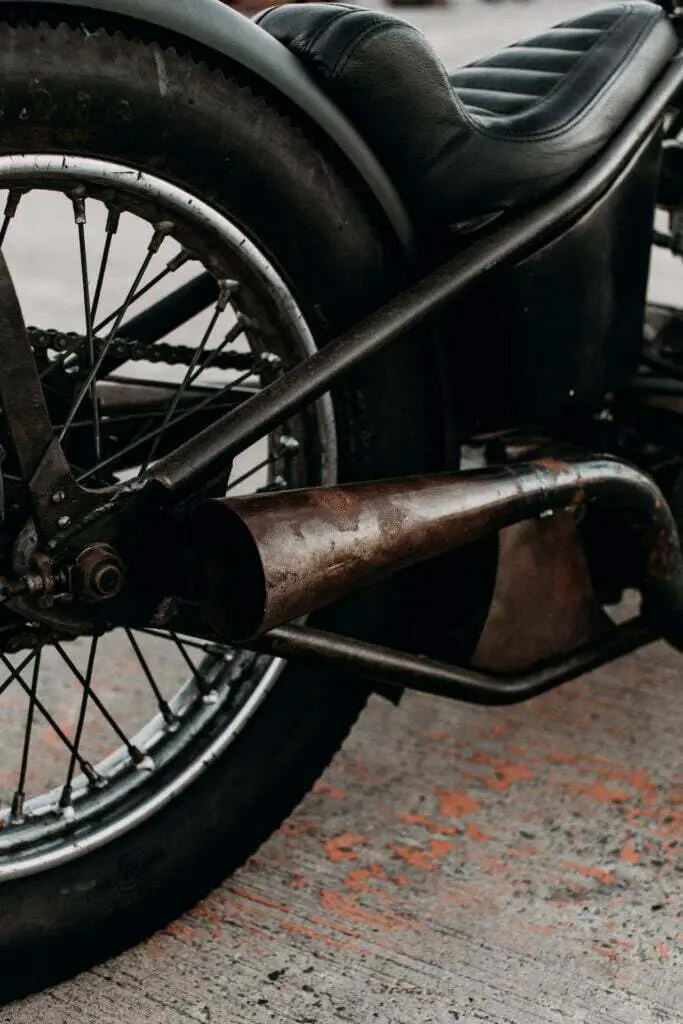 close up of motorcycle rusty exhaust