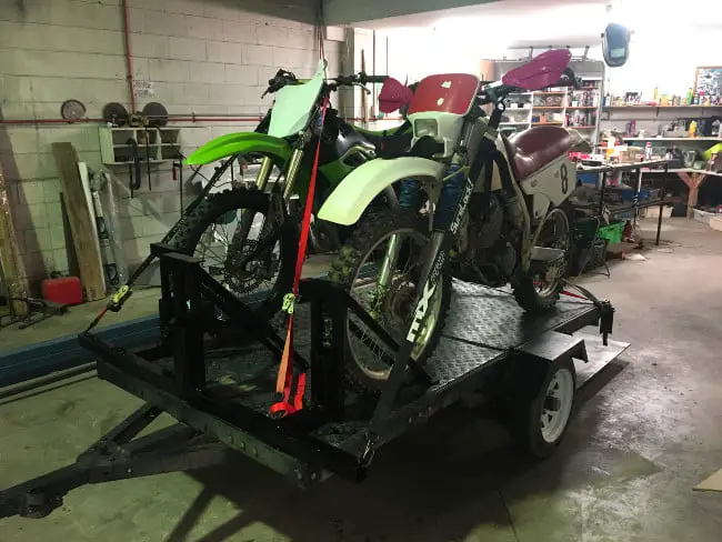 two dirt bikes on a trailer