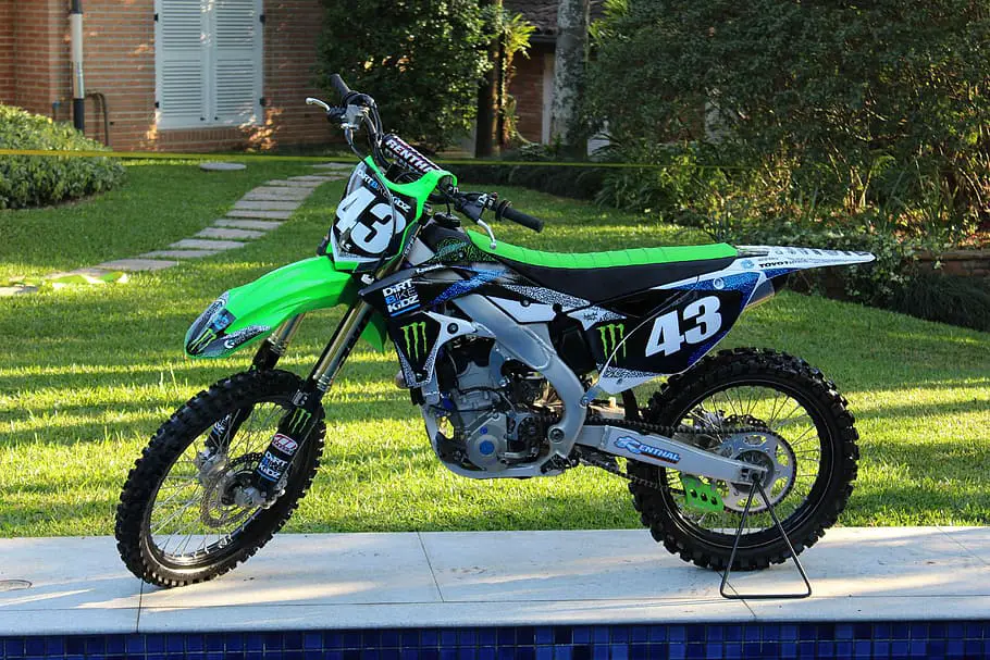 black and green motocross dirt bike