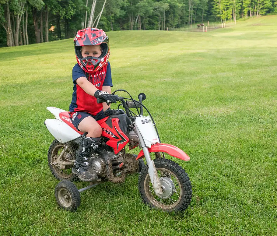 dirt-bike-training-wheels-helmet-young-boy-entertainment-childhood