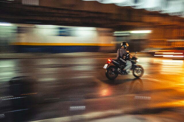 person-riding-motorcycle-in-city-traffic
